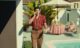 back in baby's arms - mystic film festival - narrative short - featured image - person talking on the phone by the pool