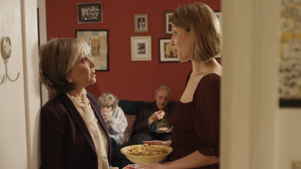cut off - mystic film festival - narrative short - featured image - two people talking in a door frame