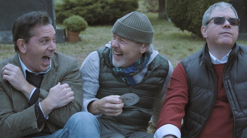 three guys laughing