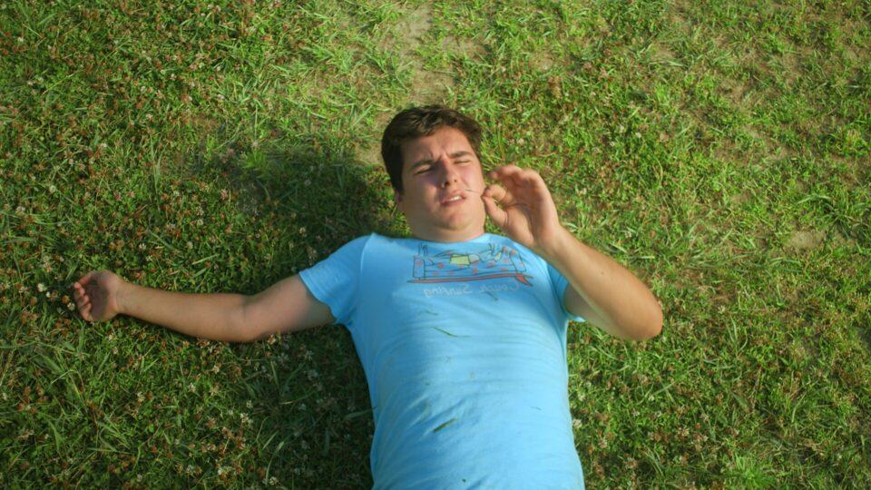 touch grass - mystic film festival - narrative short - featured image - person observing grass