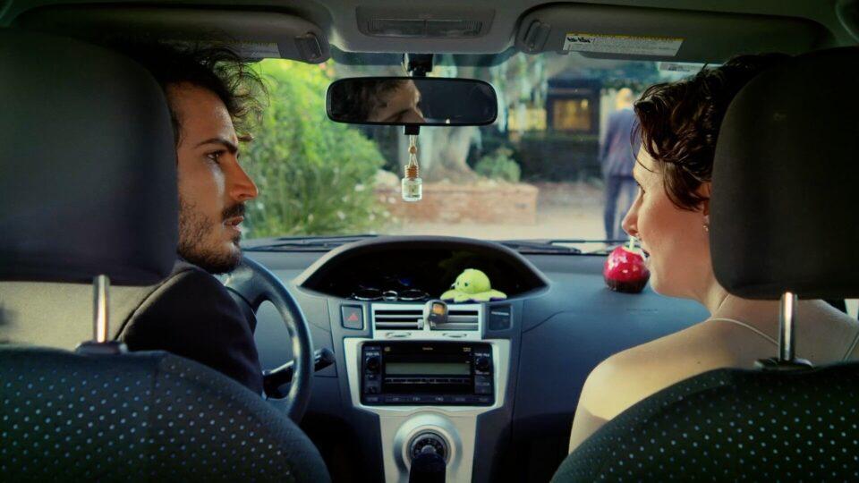 travel plans - mystic film festival - narrative short - featured image - two people in a far looking at each other